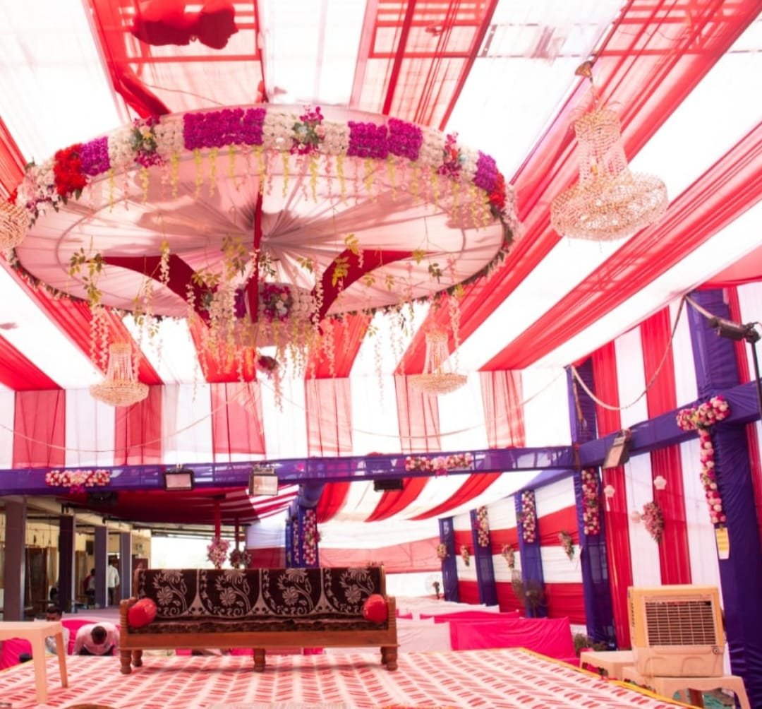 Elegant garden wedding setup with floral archway and seating arrangement