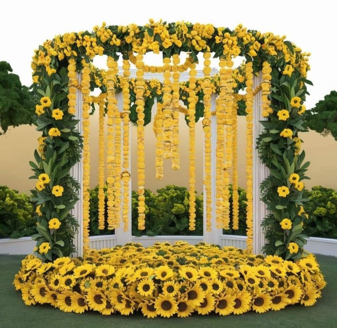 Traditional mandap decorated with vibrant flowers and golden accents