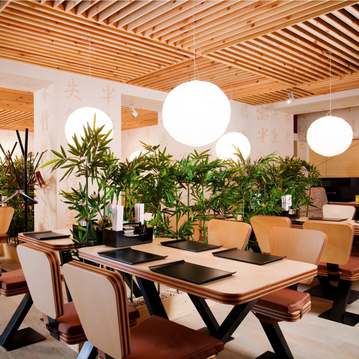 Elegant venue transformed with warm uplighting and decorative string lights